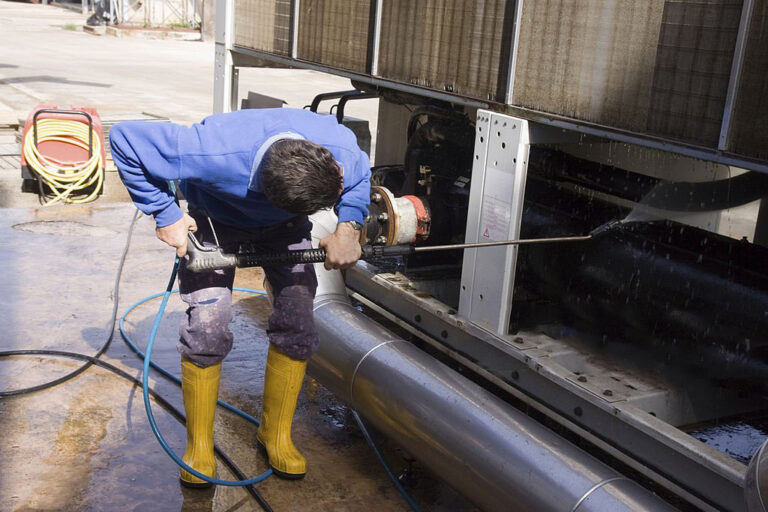 Heavy machinery pressure washing